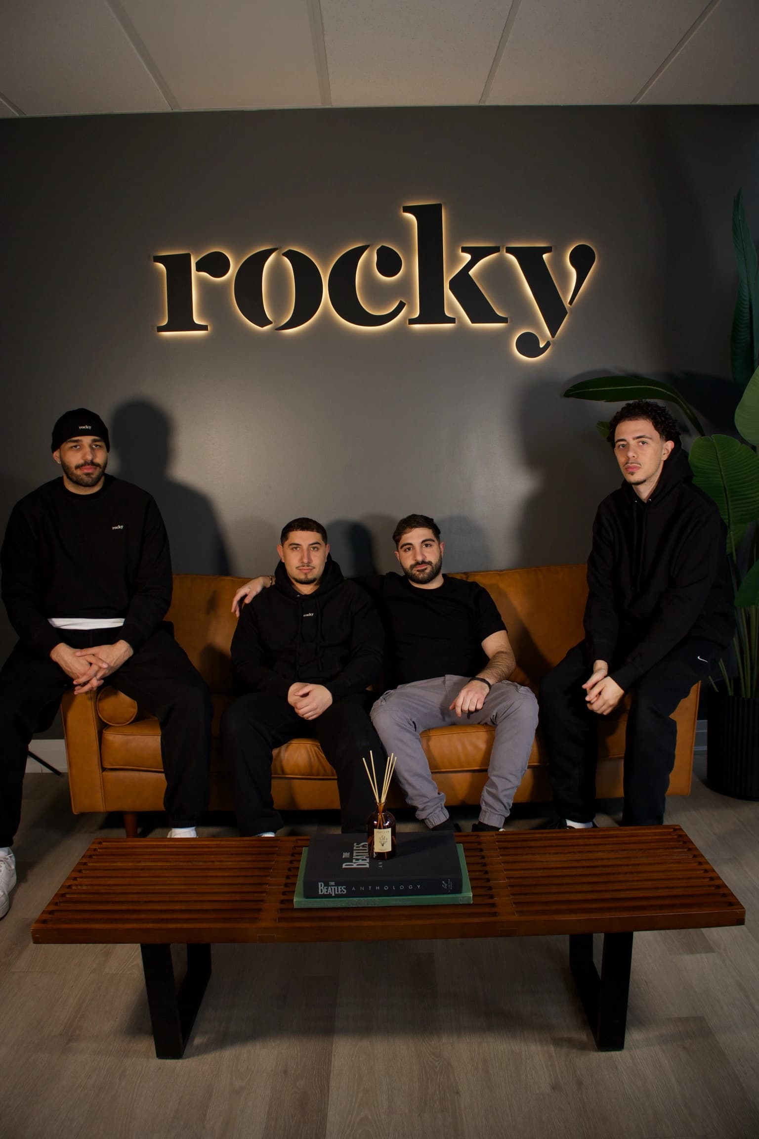 Group of five people wearing black Rocky merchandise